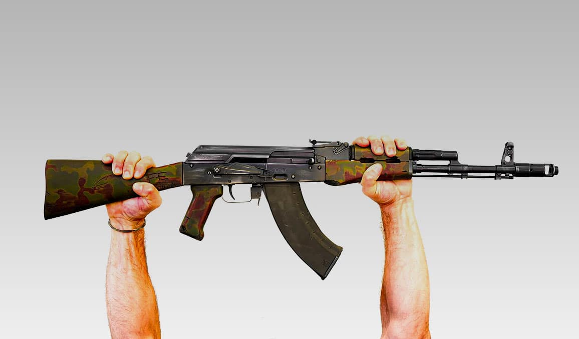 Kalashnikov USA "Conflict" rifle held by man.